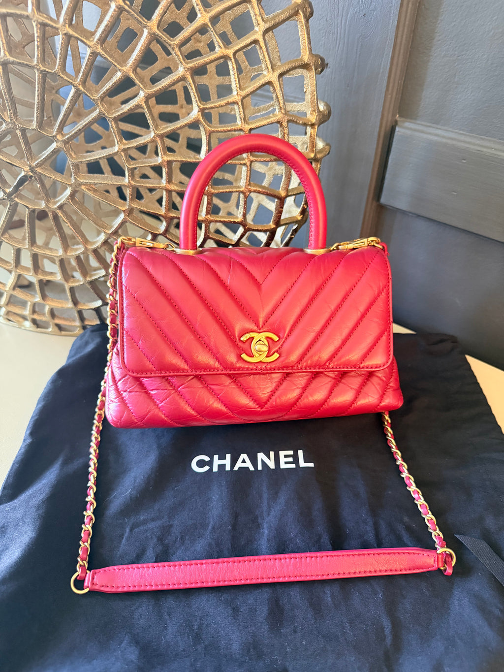 Chanel red chevron Coco Handle – Front view with detachable strap and Chanel dust bag